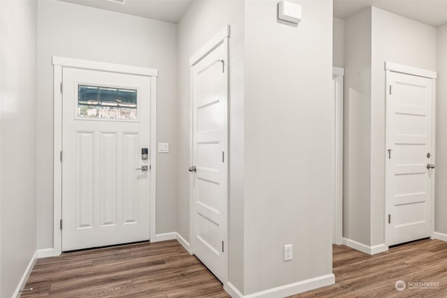 entrance foyer with dark hardwood / wood-style flooring