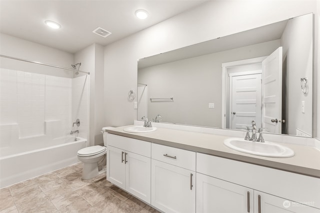 full bathroom with vanity, shower / bath combination, and toilet