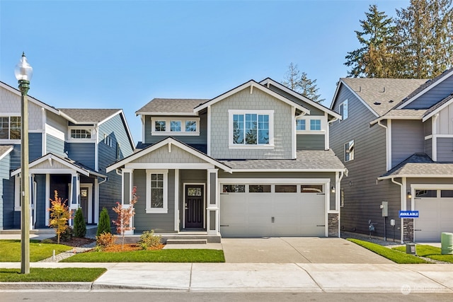 craftsman-style house with a garage and central AC unit