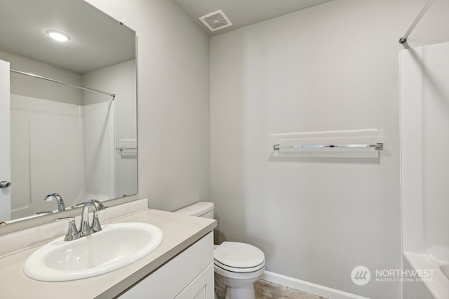 bathroom featuring baseboards, visible vents, toilet, walk in shower, and vanity