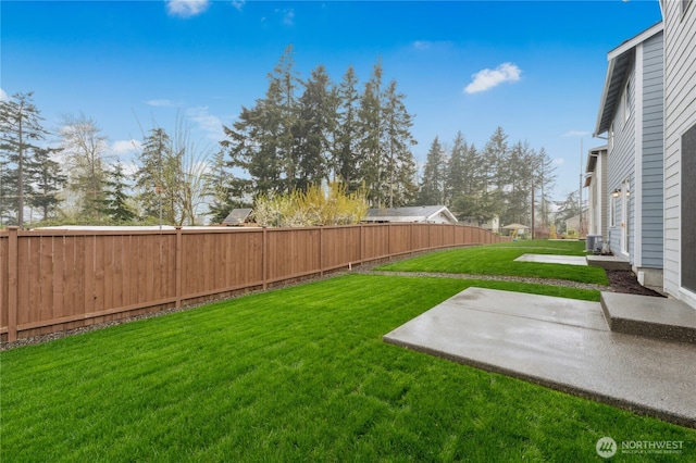 view of yard featuring a patio area, central AC, and a fenced backyard