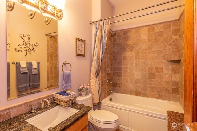 full bathroom featuring vanity, shower / bath combo, and toilet