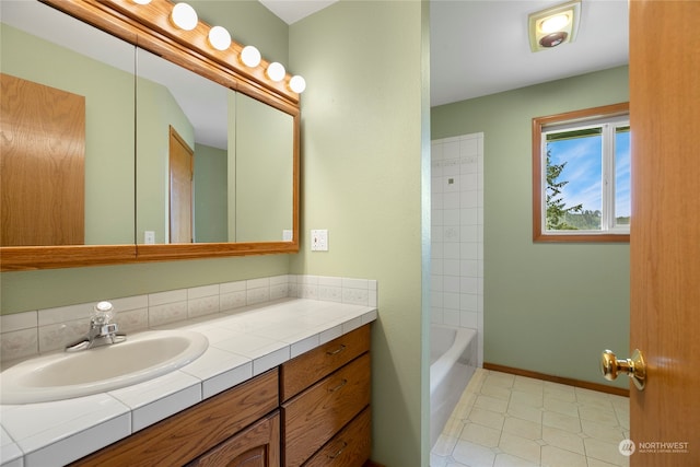 bathroom featuring baseboards and vanity