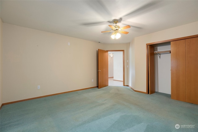 unfurnished bedroom featuring baseboards, a closet, a ceiling fan, and light colored carpet