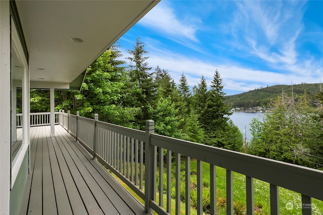 wooden terrace with a water view