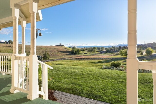 view of yard with a rural view