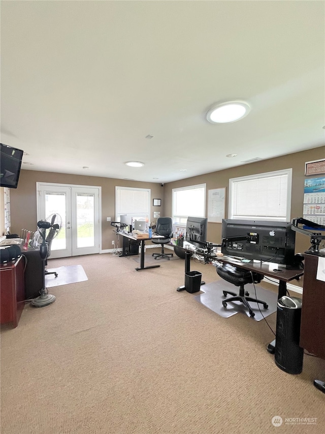 office with light carpet and french doors