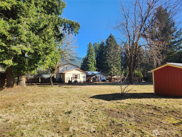 112 Combs Rd, Packwood, WA 98361 - view of yard with a storage shed and an outbuilding