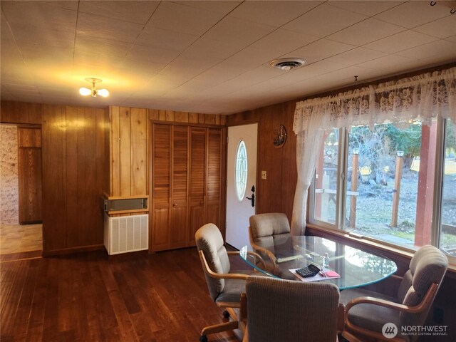 112 Combs Rd, Packwood, WA 98361 - dining space featuring wooden walls, visible vents, and dark wood-style floors