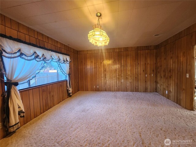 112 Combs Rd, Packwood, WA 98361 - carpeted empty room featuring wood walls