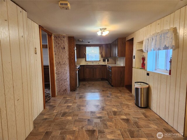 112 Combs Rd, Packwood, WA 98361 - kitchen with wooden walls and light countertops