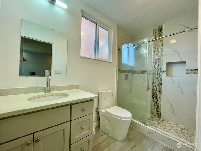 bathroom with an enclosed shower, vanity, wood-type flooring, and toilet