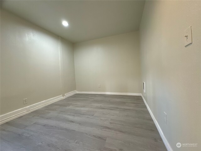 empty room with light hardwood / wood-style floors