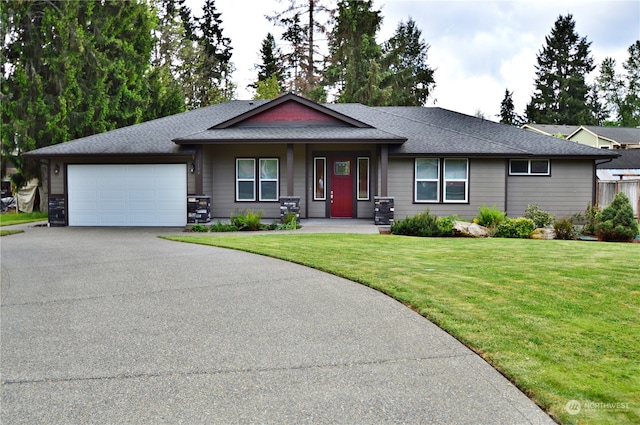 view of front facade with a front yard and a garage