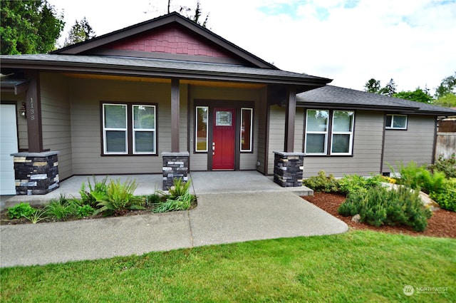 view of front of house featuring a front lawn and a porch