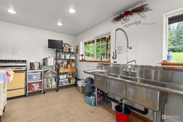 kitchen featuring electric stove and plenty of natural light