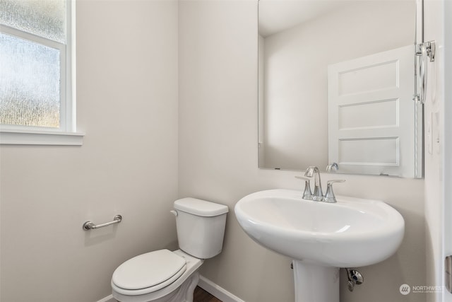 bathroom featuring sink and toilet