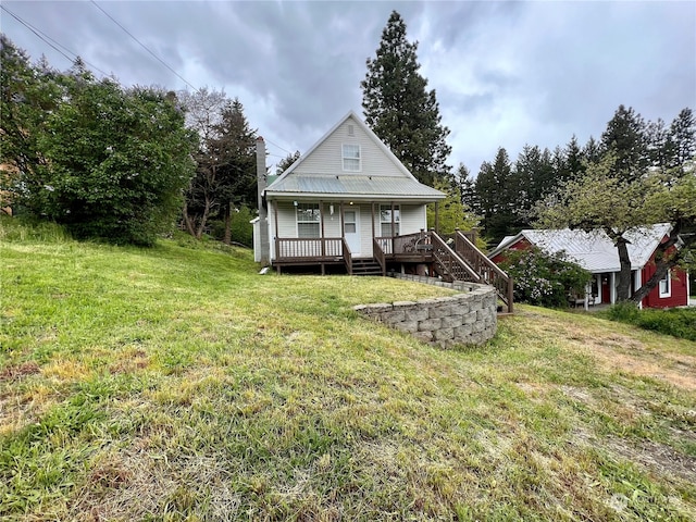 rear view of house with a yard