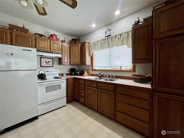 kitchen featuring ceiling fan, white appliances, sink, and light tile floors