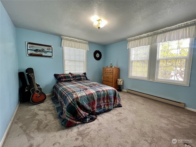 bedroom with a textured ceiling, a baseboard radiator, and carpet flooring