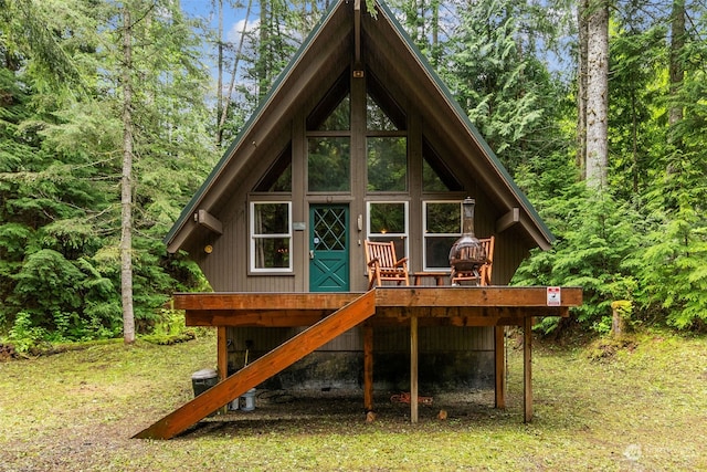 rear view of property with a deck