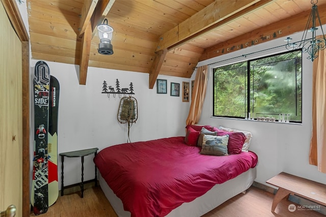 bedroom featuring wooden ceiling, hardwood / wood-style flooring, and vaulted ceiling with beams