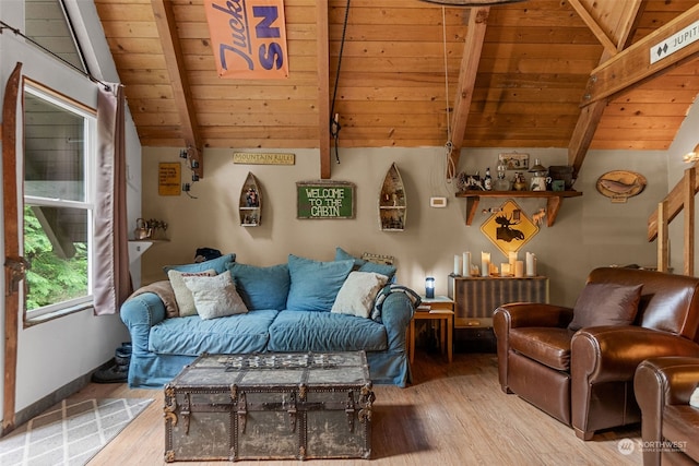 living room with vaulted ceiling with beams, hardwood / wood-style flooring, and wood ceiling