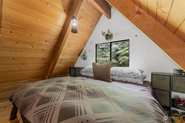 bedroom with lofted ceiling with beams, wood ceiling, and wood-type flooring