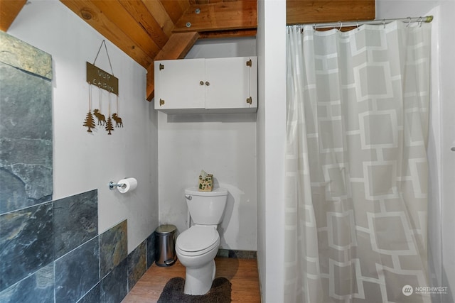 bathroom featuring tile walls, toilet, and hardwood / wood-style floors