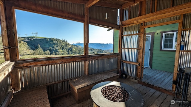 sunroom / solarium with a wealth of natural light and a mountain view