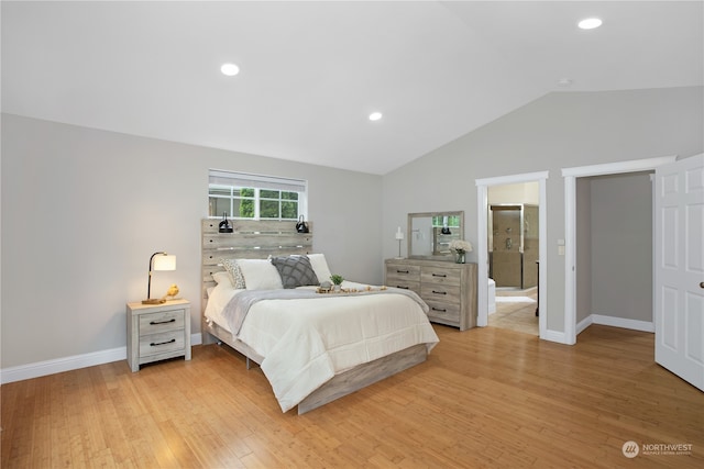 bedroom with light hardwood / wood-style flooring and lofted ceiling