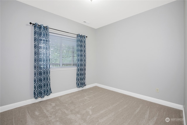 spare room featuring carpet flooring