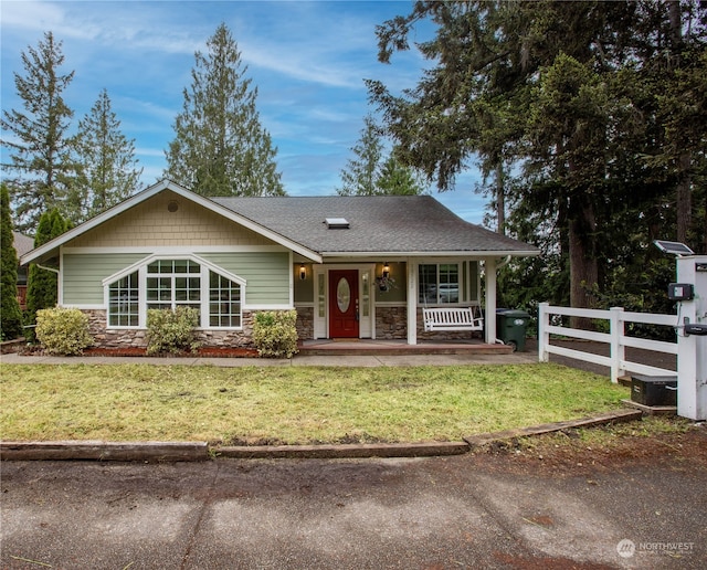 view of front of house featuring a front yard and a porch