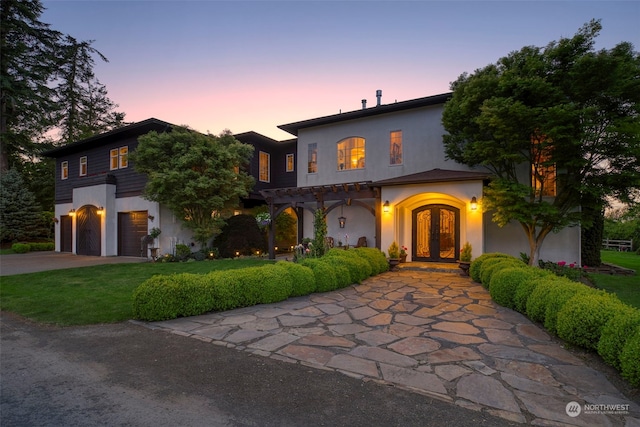 mediterranean / spanish house with a garage