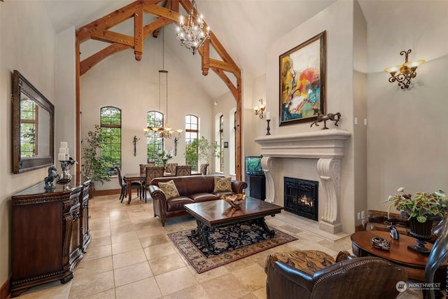 living room with high vaulted ceiling, light tile flooring, and a chandelier