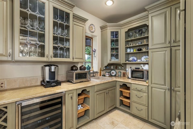 interior space featuring light tile floors, light stone counters, wine cooler, and cream cabinets