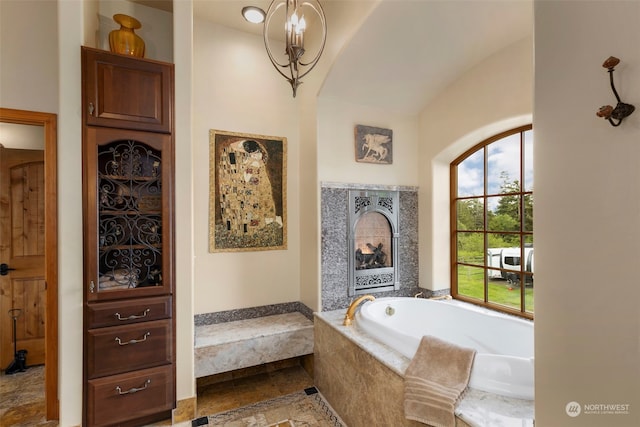 bathroom featuring tiled bath and tile flooring