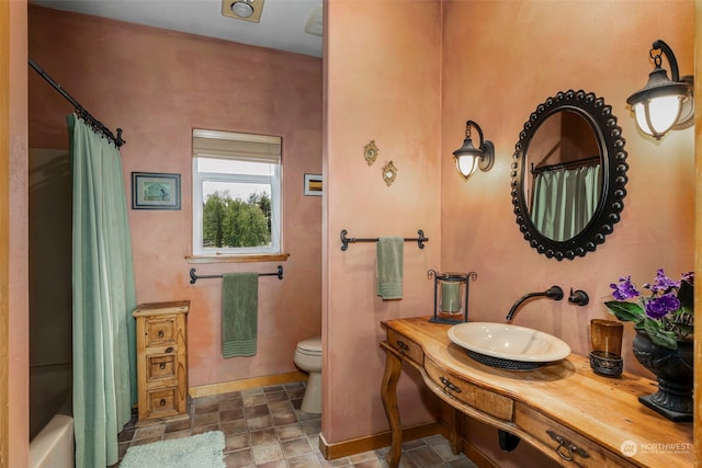 full bathroom featuring tile floors, toilet, shower / bathtub combination with curtain, and vanity