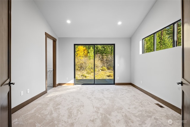 spare room with carpet, visible vents, baseboards, and recessed lighting