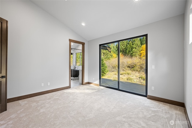 spare room featuring high vaulted ceiling, baseboards, carpet flooring, and recessed lighting