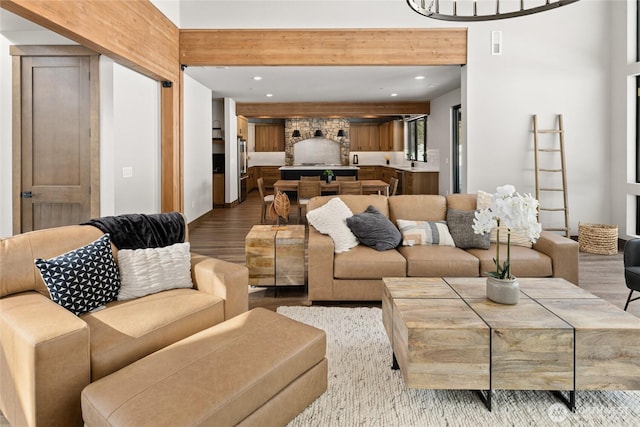 living room featuring visible vents, wood finished floors, and recessed lighting