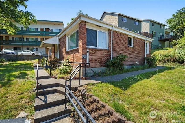 view of property exterior with a yard