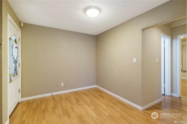 unfurnished room featuring light wood-type flooring