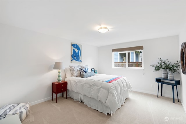 bedroom with light colored carpet