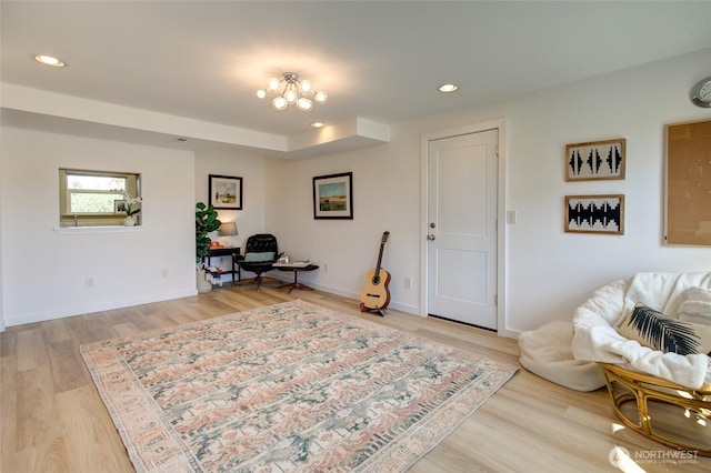 sitting room featuring recessed lighting, baseboards, and light wood-type flooring