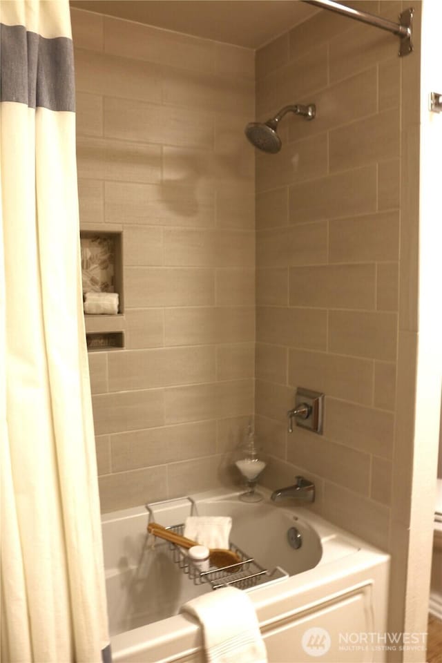 bathroom with shower / bath combo