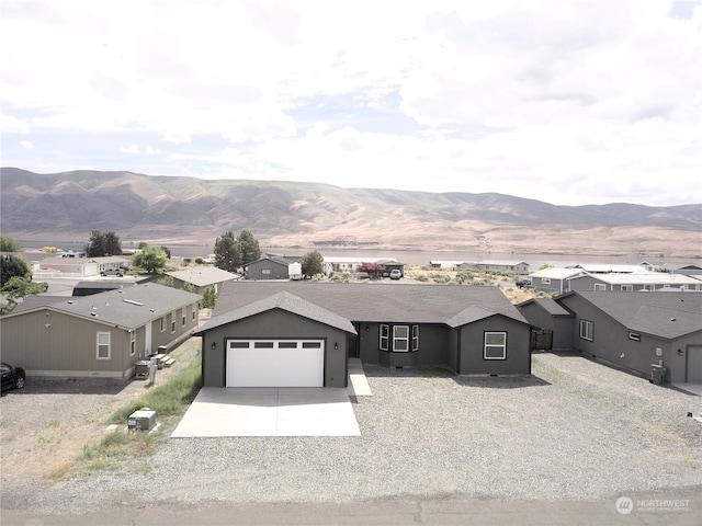 410 Summer Pl SW, Mattawa, WA 99349 - view of front of property with a garage and a mountain view