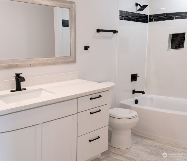 410 Summer Pl SW, Mattawa, WA 99349 - full bathroom with hardwood / wood-style flooring, tiled shower / bath combo, vanity, and toilet