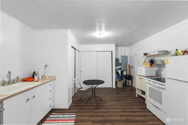 kitchen featuring white cabinetry, sink, dark hardwood / wood-style flooring, white appliances, and ornamental molding