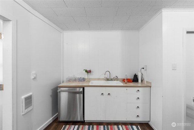 kitchen featuring heating unit, dark wood-type flooring, sink, dishwasher, and white cabinetry